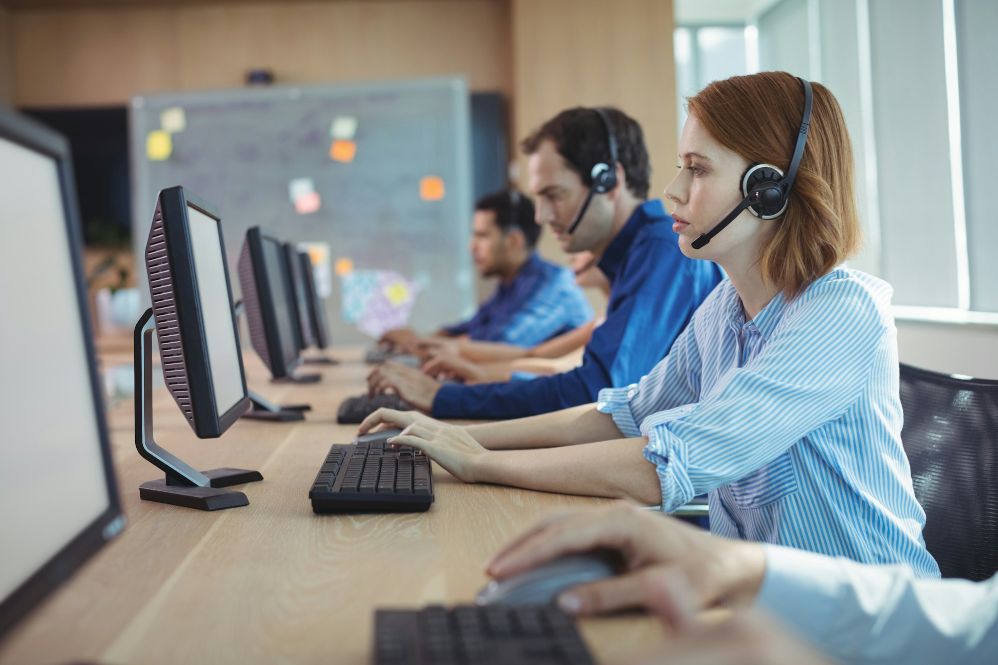 side view of businesswoman working at call center
